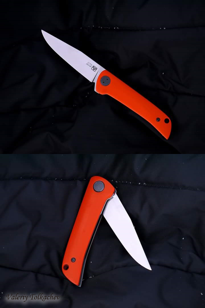 orange little Russian folder knife flipper 