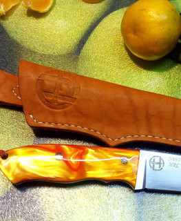 оранжевый нож из Böhler N690CO из киринита "протуберанец", мастер Геннадий Немов из Самары